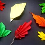 Żółte, zielone, pomarańczowe i czerwone liście wykonane techniką origami
